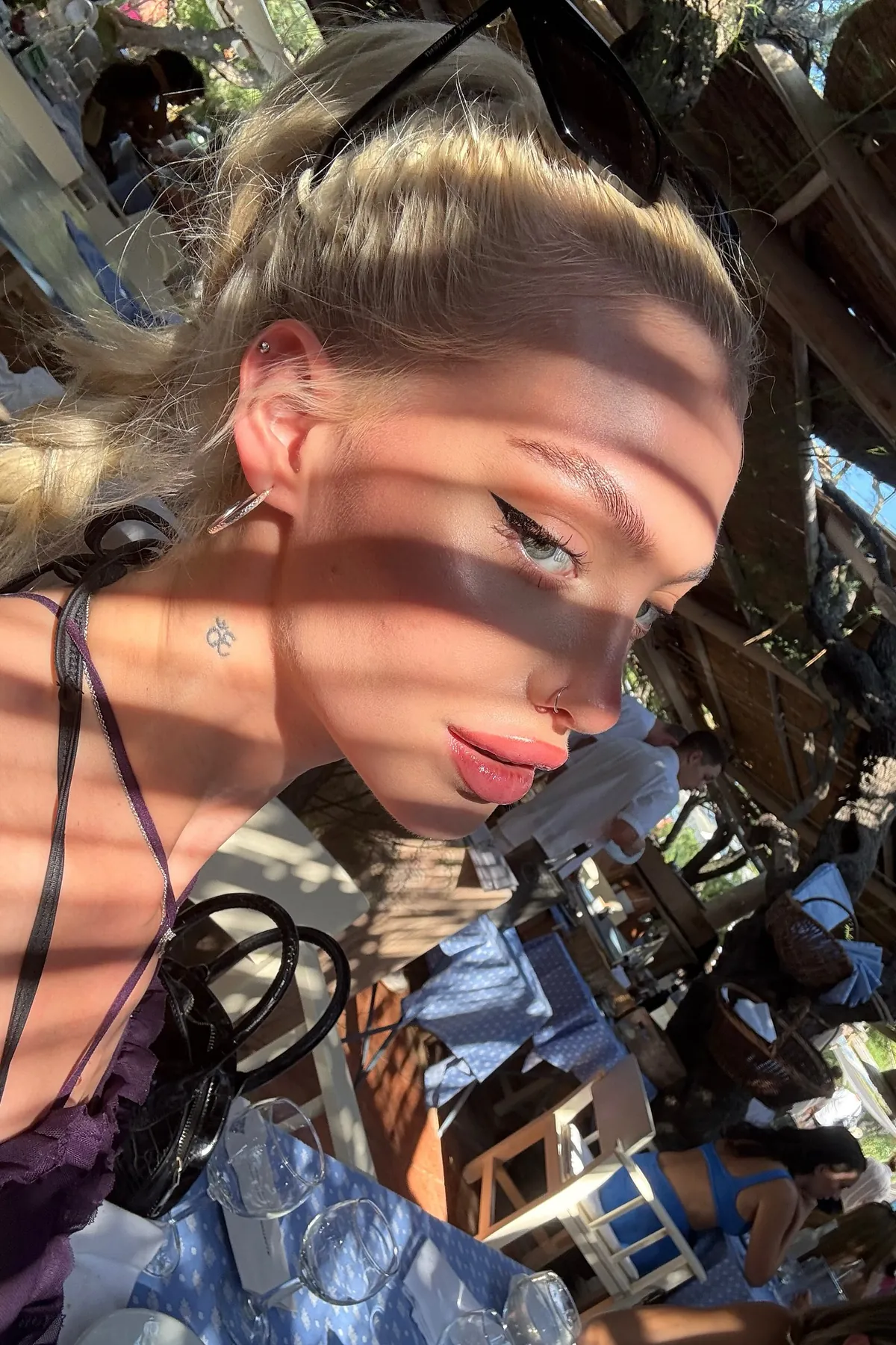 Alexandra Marianna in a close-up selfie in dappled shade in St Tropez
